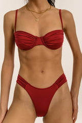 BIKINI DOLLS Bella high-cut bikini bottom with ruched sides in merlot