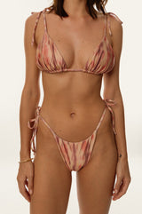 BIKINI DOLLS Gia minimal bikini bottom with side ties in Sunset Dream closeup