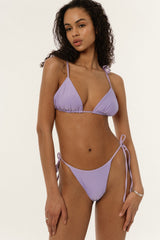BIKINI DOLLSBIKINI DOLLS Gia minimal bikini bottom with side ties in Lilac