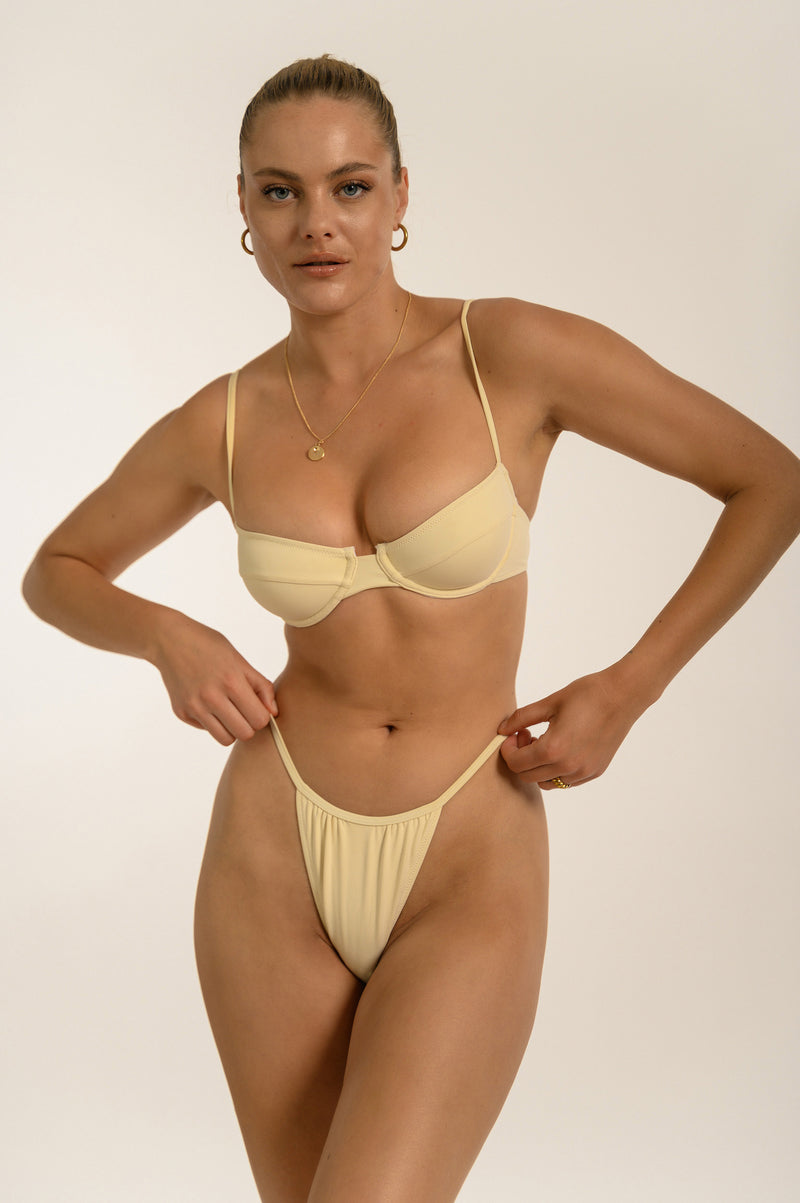 BIKINI DOLLS Jasmine minimal high cut bikini bottom with thin side straps in Ivory