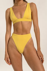 BIKINI DOLLS Sade bralette bikini top in Amarelo closeup