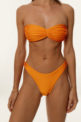 BIKINI DOLLS Juliette bandeau bikini top with ruching detail in Tangerine closeup