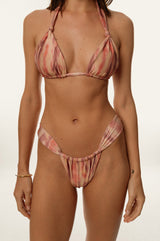 BIKINI DOLLS Cindy ruched high cut bikini bottom in Sunset Dream closeup