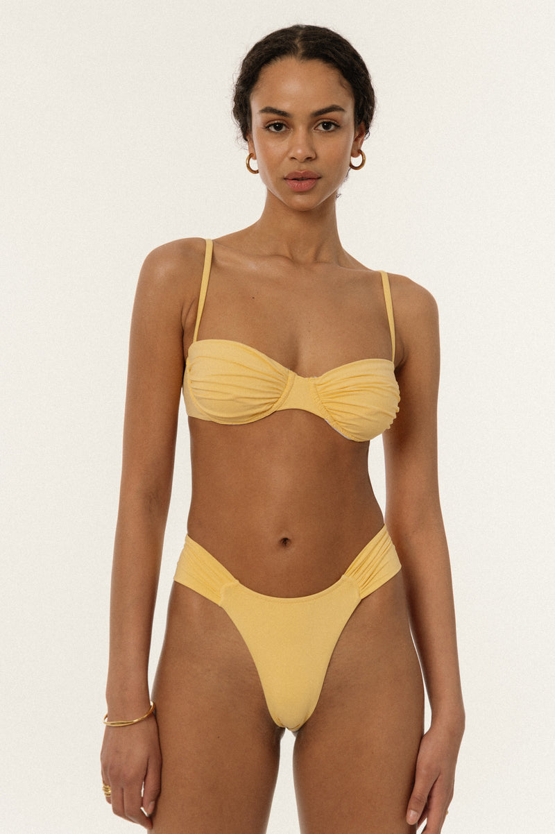 BIKINI DOLLS Bella high-cut bikini bottom with ruched sides in Amarelo