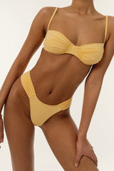 BIKINI DOLLS Bella high-cut bikini bottom with ruched sides in Amarelo closeup