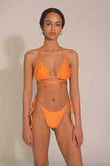 BIKINI DOLLS Gia minimal bikini bottom with side ties in Tangerine video