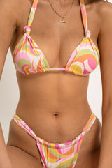 BIKINI DOLLS Cindy triangle bikini top with adjustable knots in the Paloma colorful wavy print close up